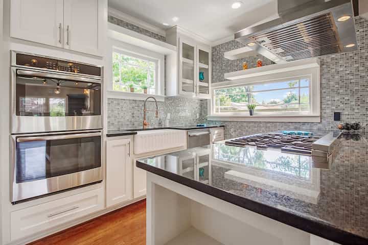 An image of a modern kitchen with sleek appliances, featuring a gas stove, refrigerator, and built-in microwave in Midlothian